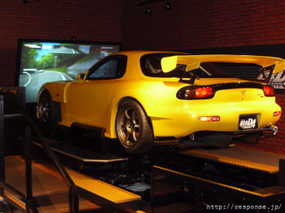 Illustration for article titled Japanese Initial D Arcade Booth Features Actual Tofu Car